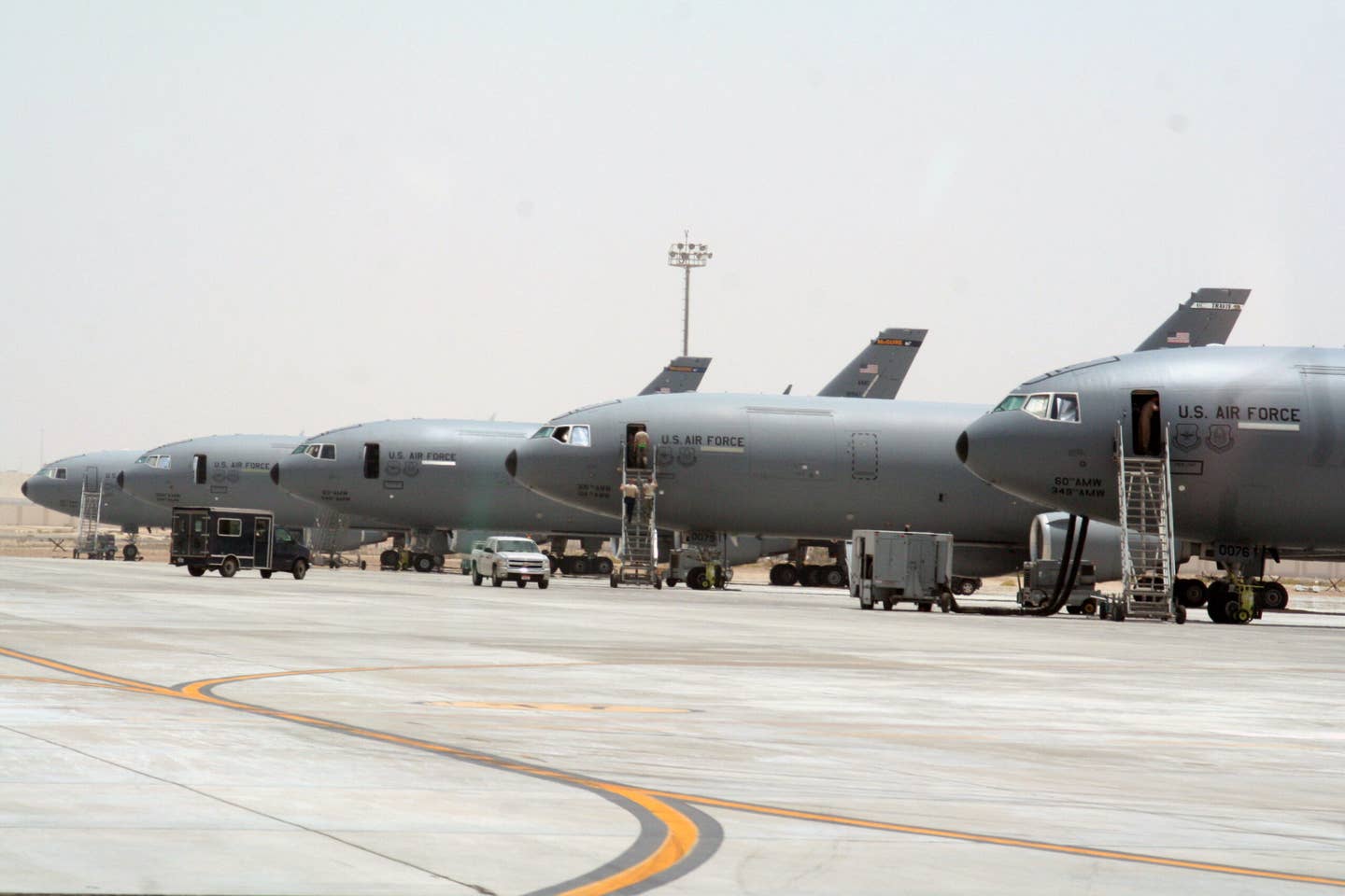 KC-10 Extender aircraft from the 908th Expeditionary Air Refueling Squadron are parked on the flightline for the 380th Air Expeditionary Wing at a non-disclosed base in Southwest Asia on May 19, 2010. (USAF)