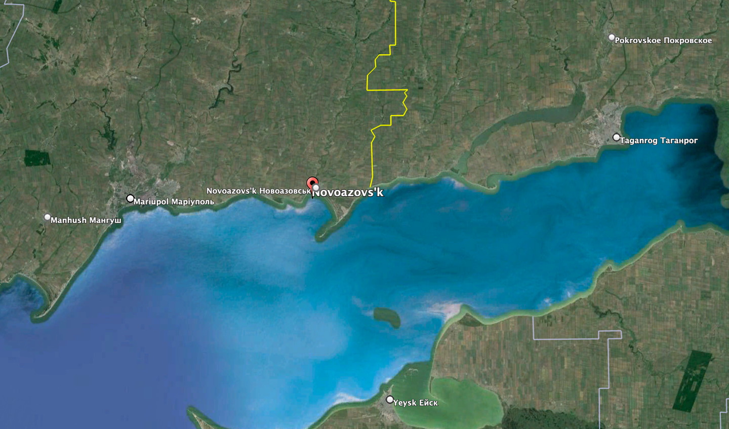 The location of Novoazovsk on the Sea of Azov, with Mariupol to the west and Taganrog to the east, on the Russian side of the border (marked here as a yellow line). <em>Google Earth</em>