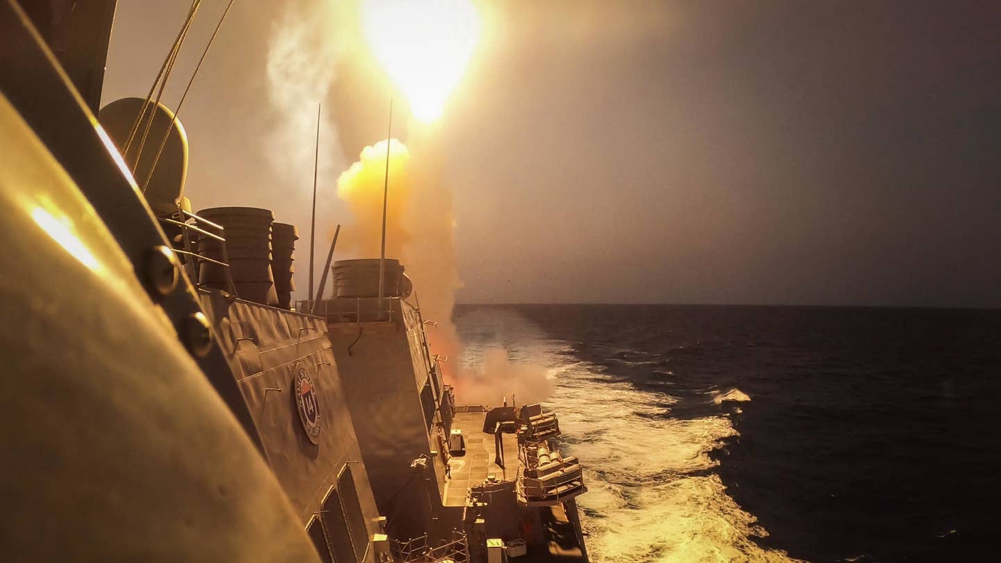 The <em>Arleigh Burke</em> class destroyer USS <em>Carney</em> fires a surface-to-air missile at Houthi threats on October 19, 2023. <em>USN</em>