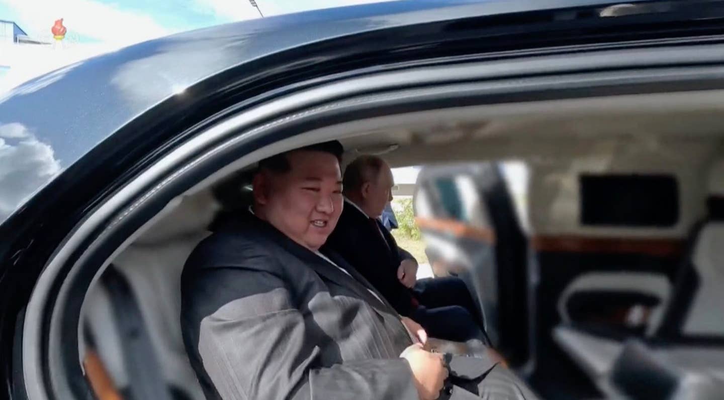 Blurred <em>KCTV</em> imagery of Kim and Putin inside the Aurus Senat limousine. <em>KCTV</em>