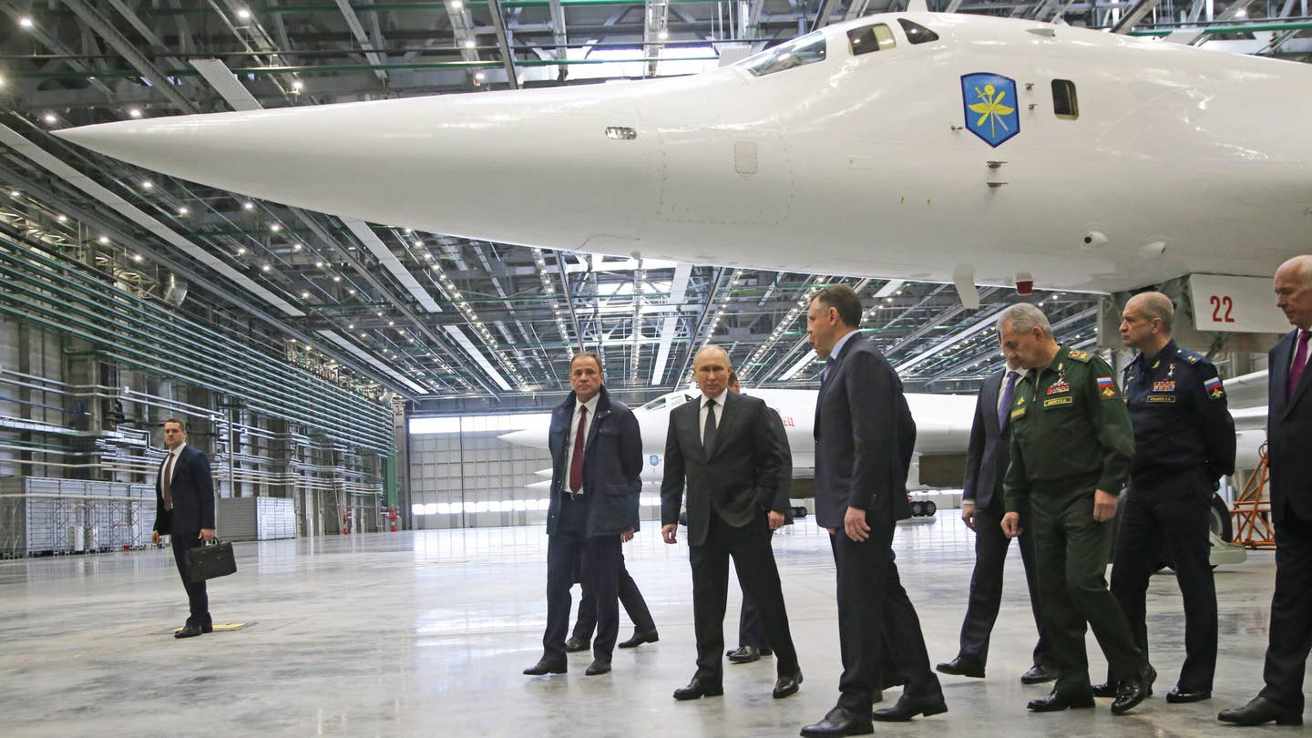 Russian President Vladimir Putin (center) observes a Tu-160 bomber while visiting the Kazan Aviation Plant on February 21, 2024. <em>Photo by Contributor/Getty Images</em>