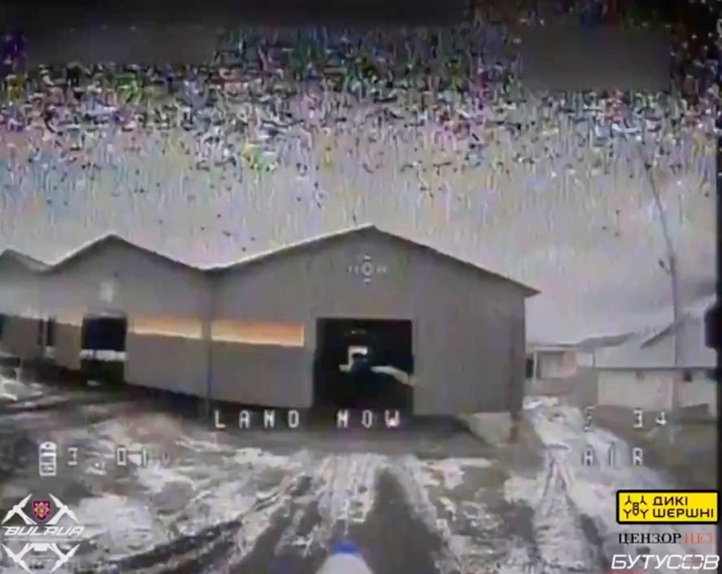 First FPV drone seen slowly approaching one of the warehouse's entrances. <em>Via Twitter/X</em>