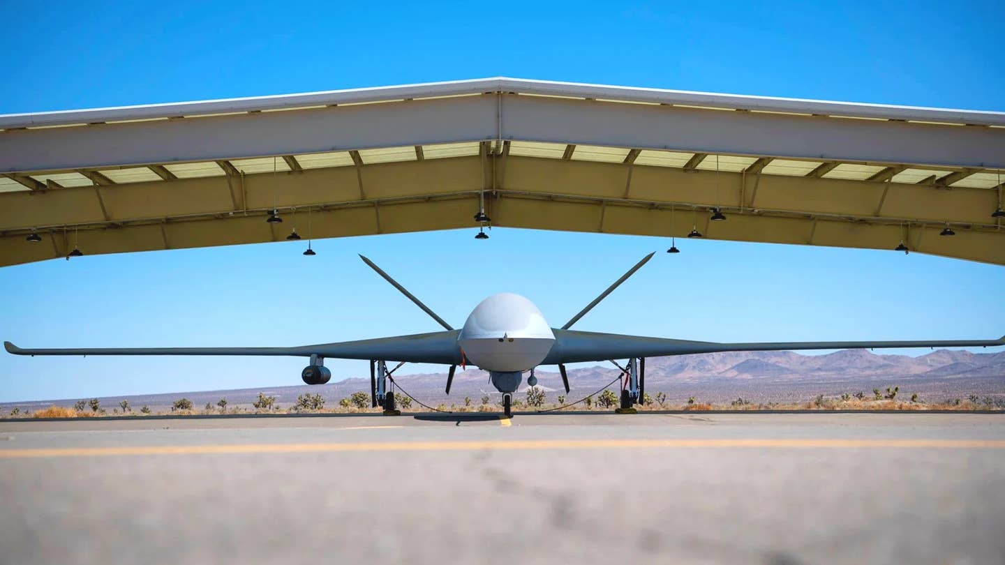 A General Atomics Avenger drone with a podded IRST system under its right wing. <em>General Atomics</em>