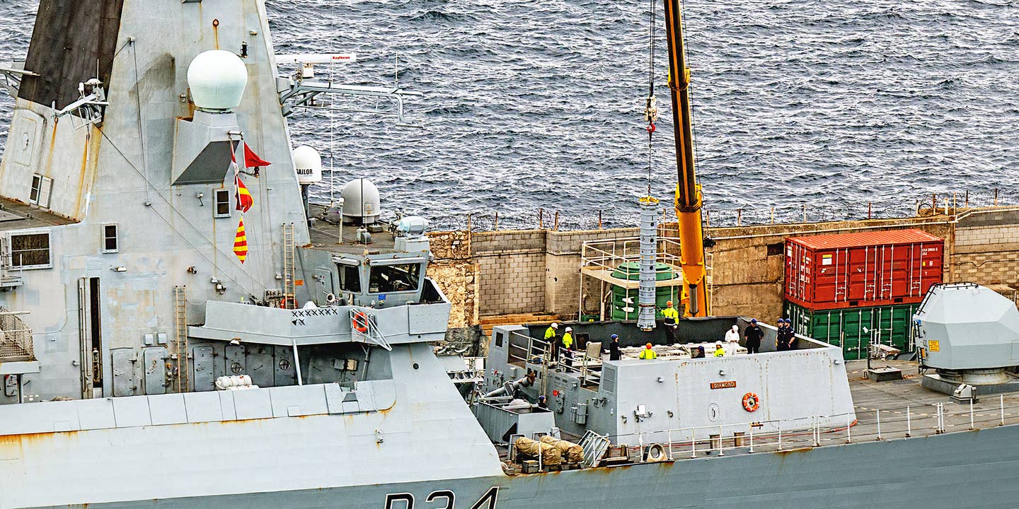 Sea Viper missiles being loaded onto HMS Diamond