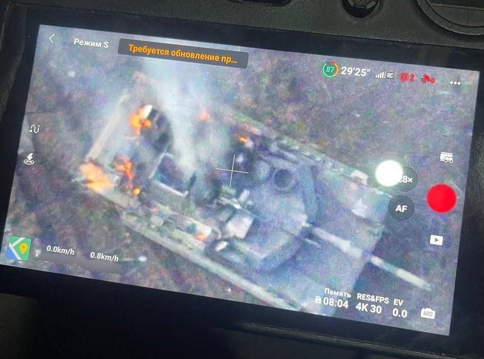 The Ukrainian Abrams tank that was said to have been attacked near Avdiivka as viewed from the top down through a handheld controller for a drone. <em>via X</em>