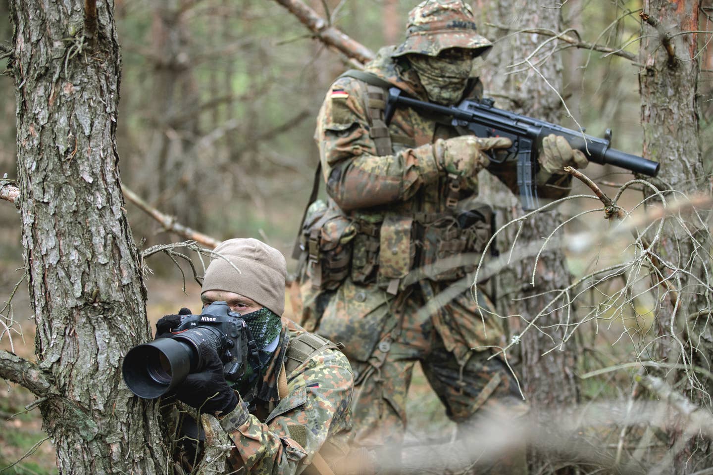 German military personnel during training. The individual at the rear is armed with an MP5SD submachine gun variant. <em>Bundeswehr</em>