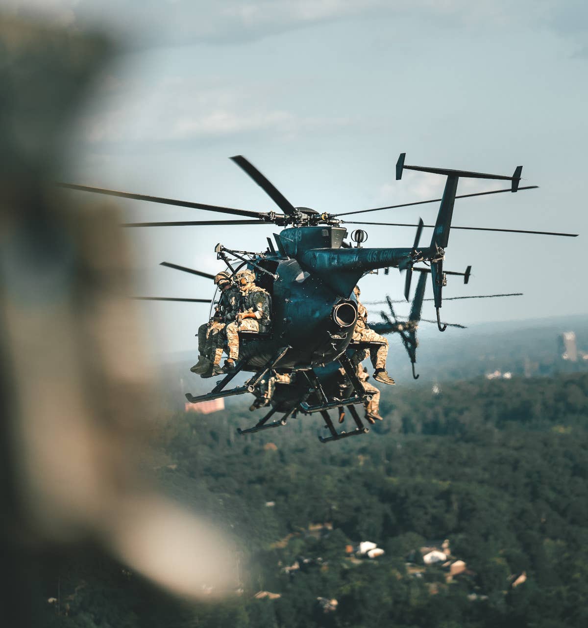 Members of the U.S. Army's 75th Ranger Regiment ride on 160th SOAR MH-6Ms during a training exercise in 2023. <em>U.S. Army</em>