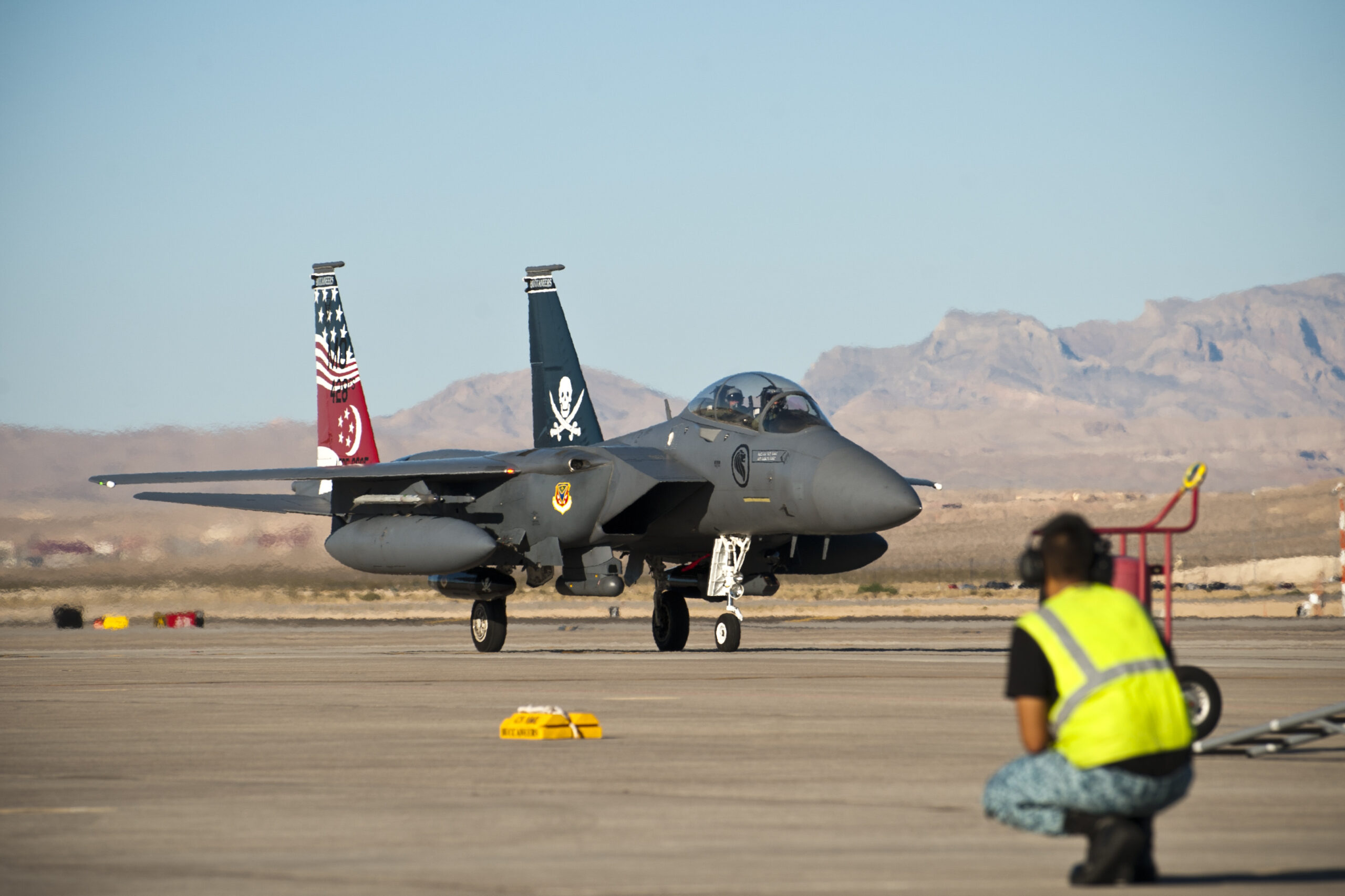 A Republic of Singapore Air Force crew chief waits for the arrival of an F-15SG before the start of Exercise Red Flag 14-3, July 11, 2014, at Nellis Air Force Base, Nevada. <em>U.S. Air Force photo by Airman 1st Class Thomas Spangler</em>