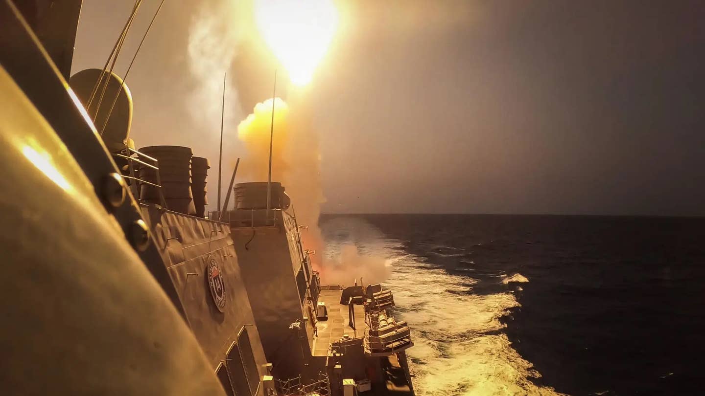 The&nbsp;<em>Arleigh Burke</em>&nbsp;class destroyer USS&nbsp;<em>Carney</em>&nbsp;fires a surface-to-air missile at Houthi threats on October 19, 2023.&nbsp;<em>U</em>.S. Navy