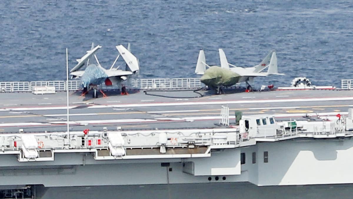 J-15 AND J-35 MOCKUPS ON THE AIRCRAFT CARRIER LIAONING