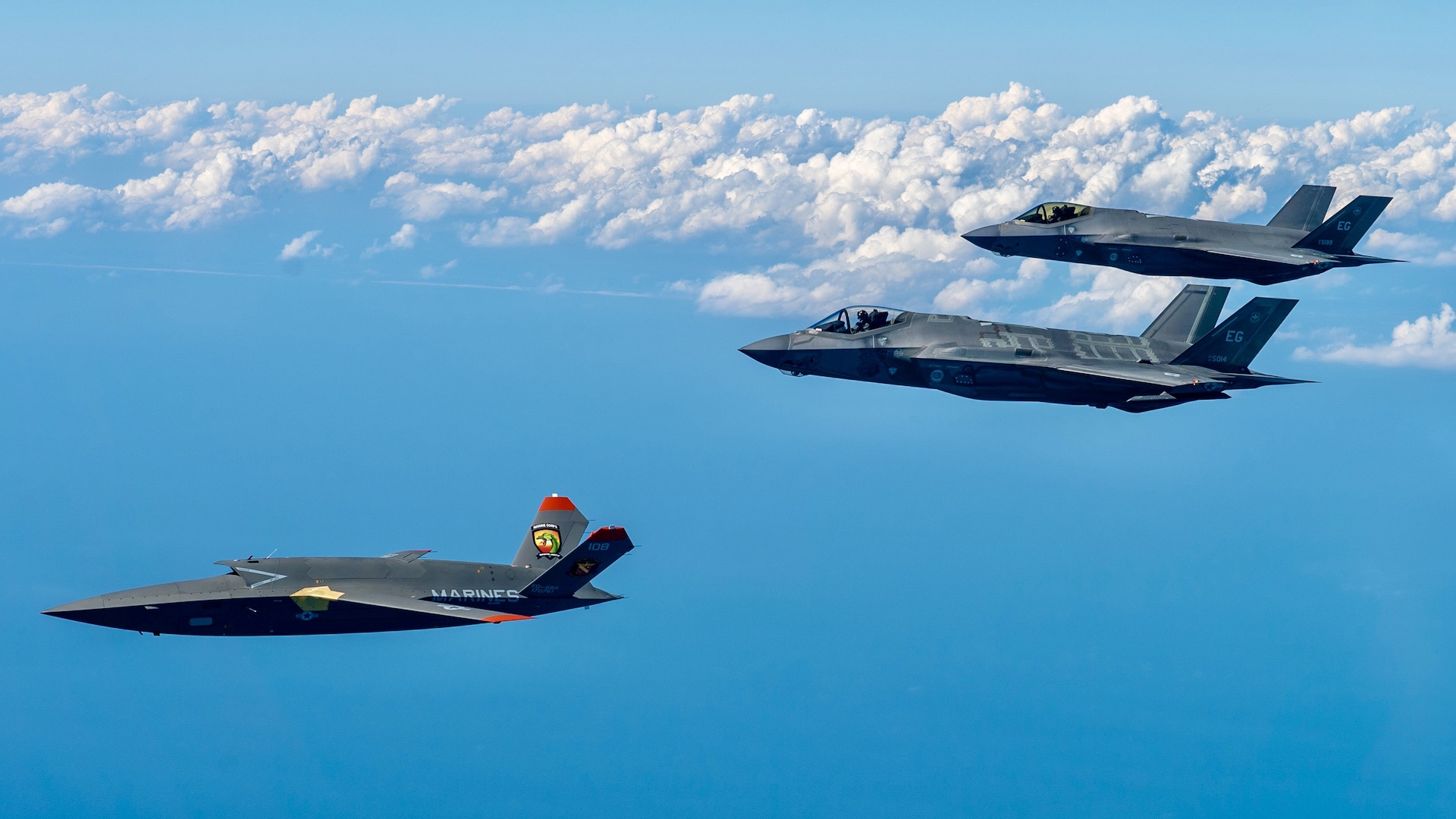 A U.S. Marine Corps XQ-58A Valkyrie, highly autonomous, low-cost tactical unmanned air vehicle, conducts its second test flight with two U.S. Air Force F-35A Lightning II aircraft assigned to 33rd Fighter Wing, 96th Test Wing at Eglin Air Force Base, Fla., Feb. 23, 2023. The XQ-58A Valkyrie test flight and the data collected inform future requirements for the Marine Corps in a rapidly evolving security environment, while successfully fueling joint innovation and experimentation opportunities. (U.S. Air Force photo by Master Sgt. John McRell)