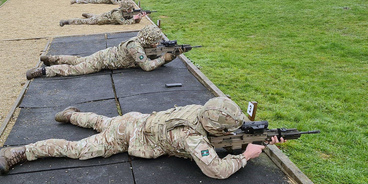 Members of 2 Yorks with SMASH sight-equipped L85A3 rifles during their evaluation in 2022. The two individuals closest to the camera have rifles with SMASH X4 sights, while the individual seen in the back has a SMASH 2000/3000-type sight. <em>Crown Copyright</em>
