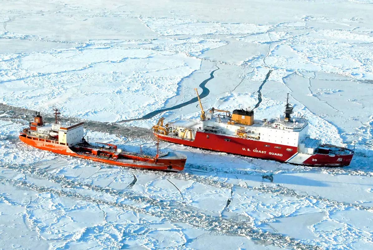 The USCGC <em>Healy</em> helps free a Russian-flagged tanker from the ice near Alaska in 2012. <em>USCG </em>