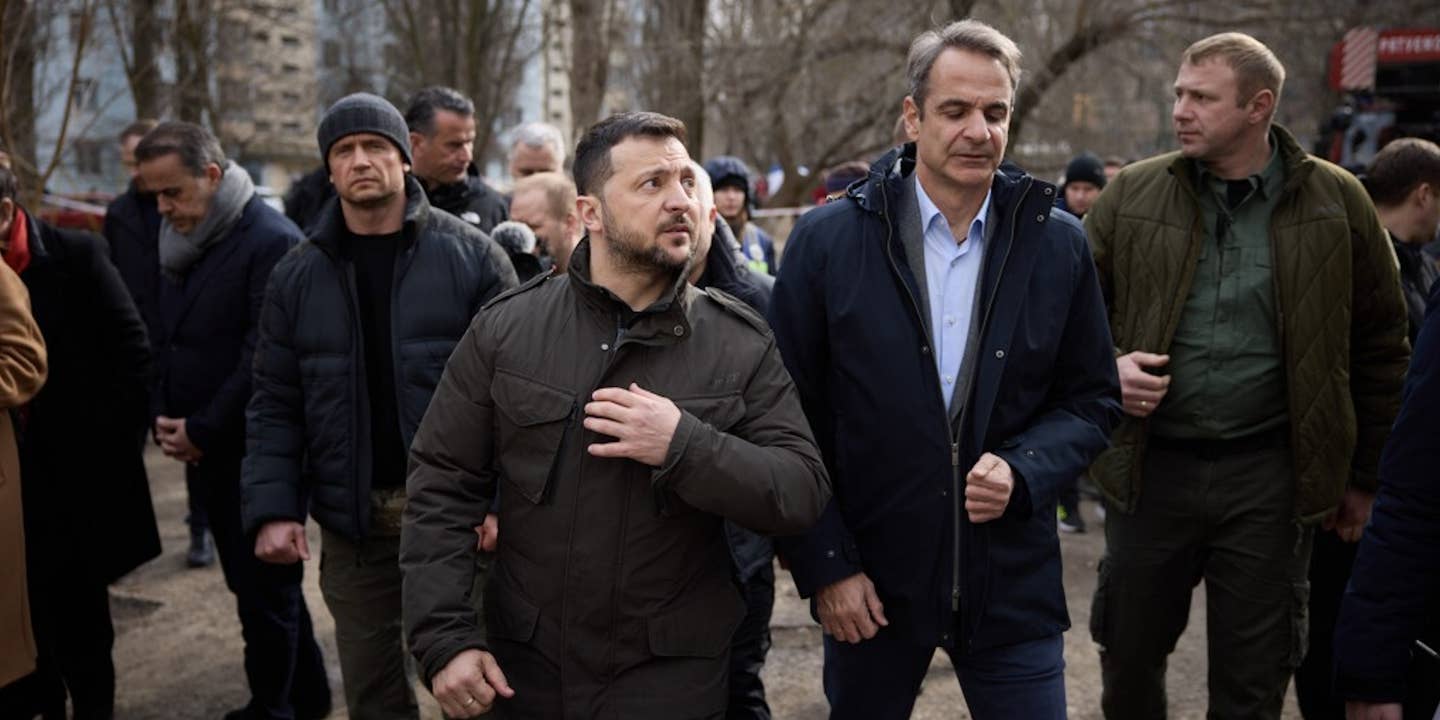 President of Ukraine Volodymyr Zelenskyy (3rd R) and Prime Minister of Greece Kyriakos Mitsotakis (2nd R) tour the streets destroyed by the ongoing war between Russia and Ukraine during Mitsotakis's official visit in Odesa, Ukraine on March 6, 2024. The leaders then arrived at the port of Odesa, which has been repeatedly attacked by Russian missiles and drones, to inspect the functioning of the 'grain corridor' in Odesa.