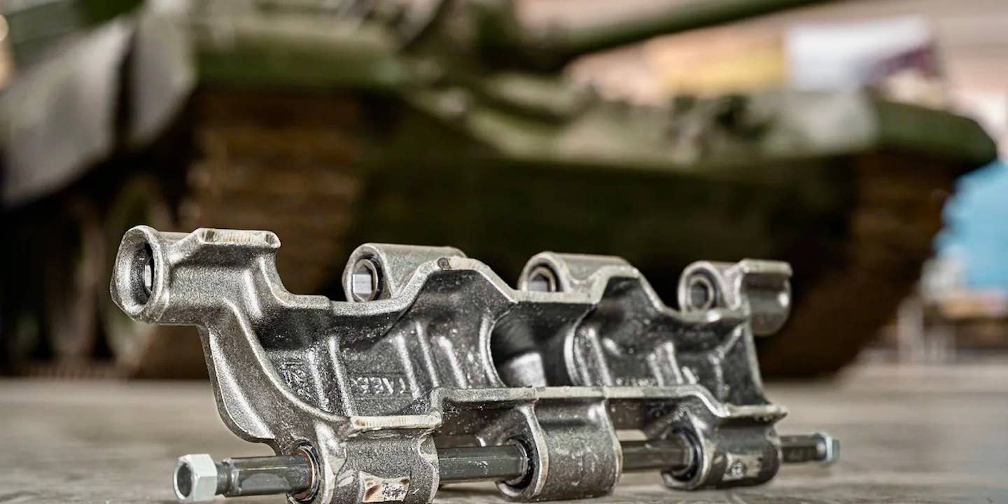 A close-up shot of part of a T-72 tank track, produced by Cook Defence Systems