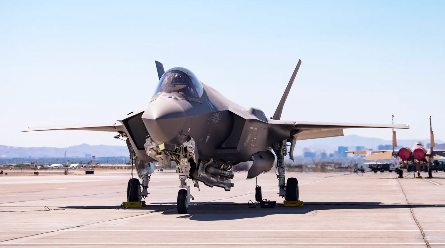 An F-35A carrying a B61-12 Joint Test Assembly sits on the flight line at Nellis Air Force Base, Nevada, on September 21, 2021. The bomb itself is not visible, but the jet also carries a pair of AIM-120 AMRAAM air-to-air missiles in its weapons bays.&nbsp;<em>U.S. Air Force/Airman 1st Class Zachary Rufus</em>
