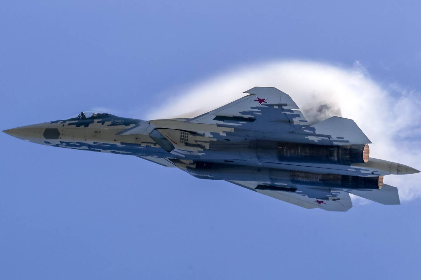 A Su-57 performs a flying display at the 2019 MAKS Moscow International Airshow near Zhukovsky, southeast of Moscow. The LEVCONs can be seen angled sharply downward. <em>Photo by Leonid Faerberg/SOPA Images/LightRocket via Getty Images</em>