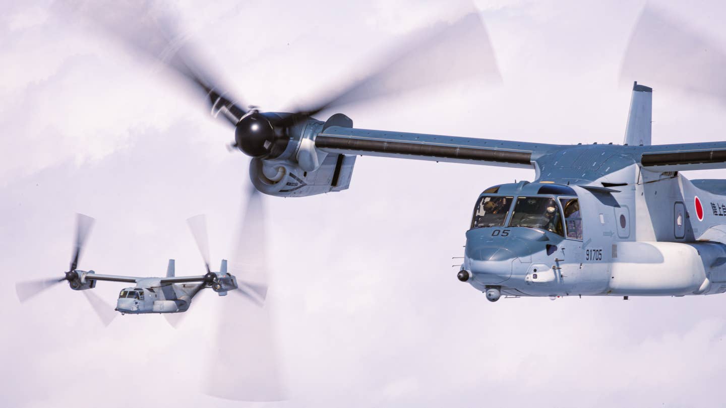 A U.S. Marine Corps MV-22B Osprey with Marine Medium Tiltrotor Squadron 265 (Reinforced), 31st Marine Expeditionary Unit, and a Japan Ground Self-Defense Force V-22 Osprey with the 107th Aviation Unit conduct a bilateral formation flight over Mount Fuji, Japan, March 2022. <em>U.S. Marine Corps photo by Lance Cpl. Cesar Ronaldo Alarcon</em>