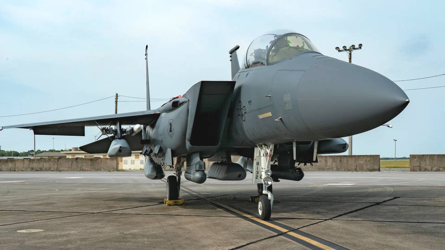 An F-15E Strike Eagle loaded with five AGM-158 Joint Air-to-Surface Standoff Missile (JASSM) cruise missiles at Eglin Air Force Base in Florida on May 11, 2021, as part of Project Strike Rodeo. <em>USAF</em>