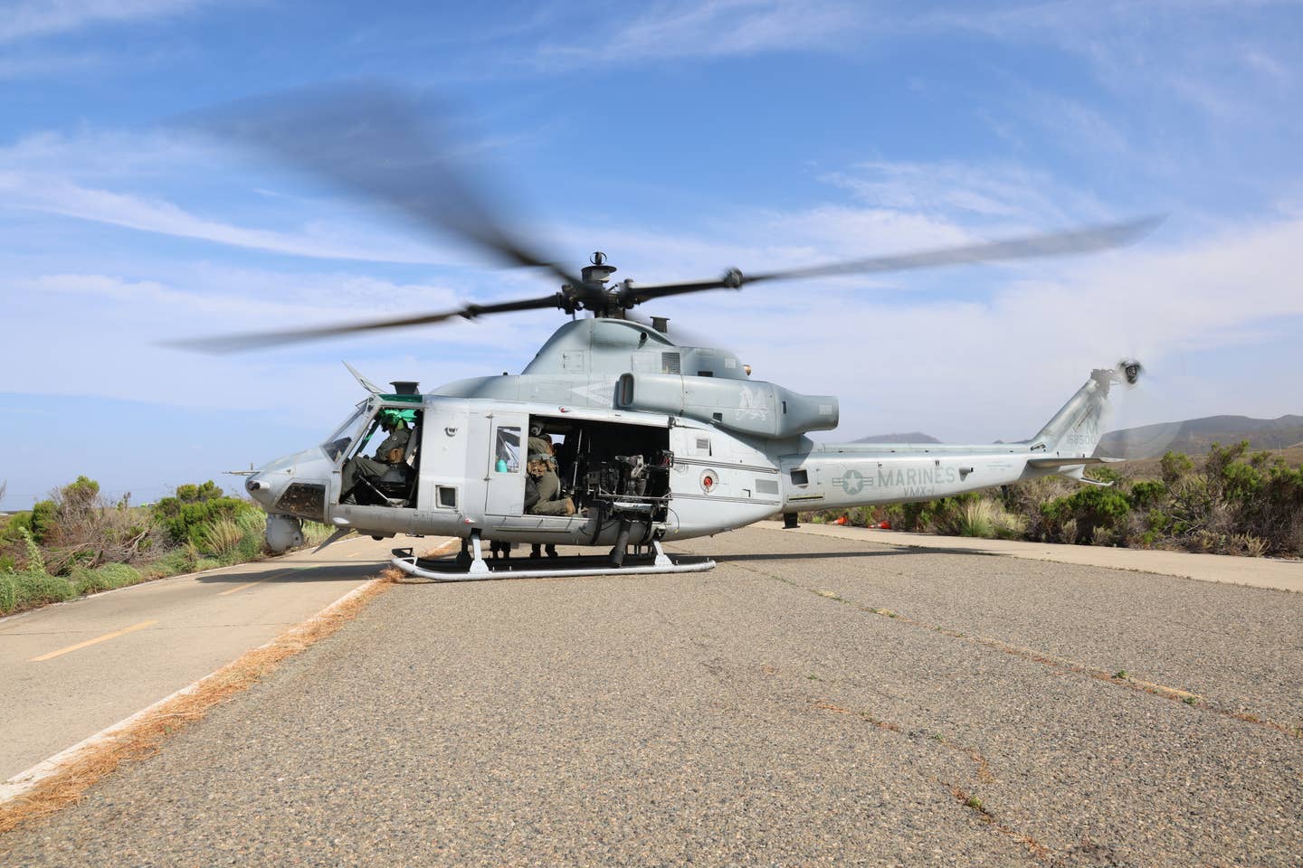 A VMX-1 UH-1Y sits on the roadway during the exercise. (James Deboer)
