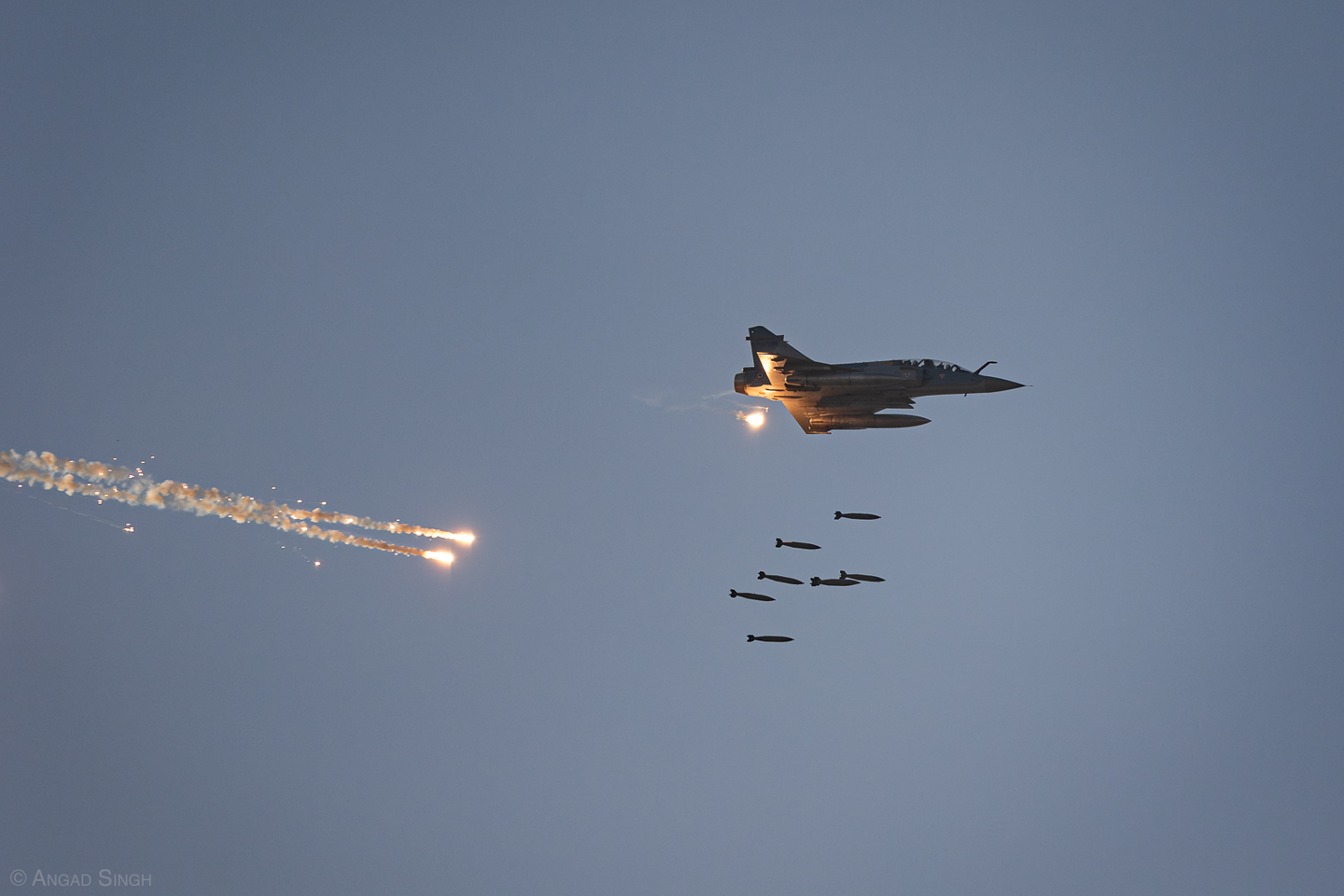 A Mirage 2000TI dropping eight 250-kilogram dumb bombs. <em>Angad Singh</em>