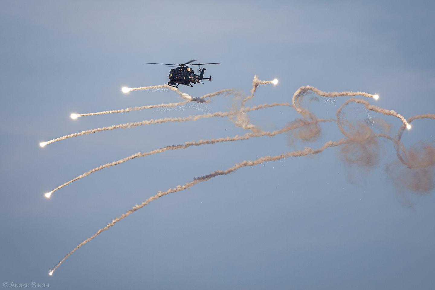 An Indian Army HAL Rudra ALH spewing flares as it runs in to complete a rocket attack. <em>Angad Singh</em>