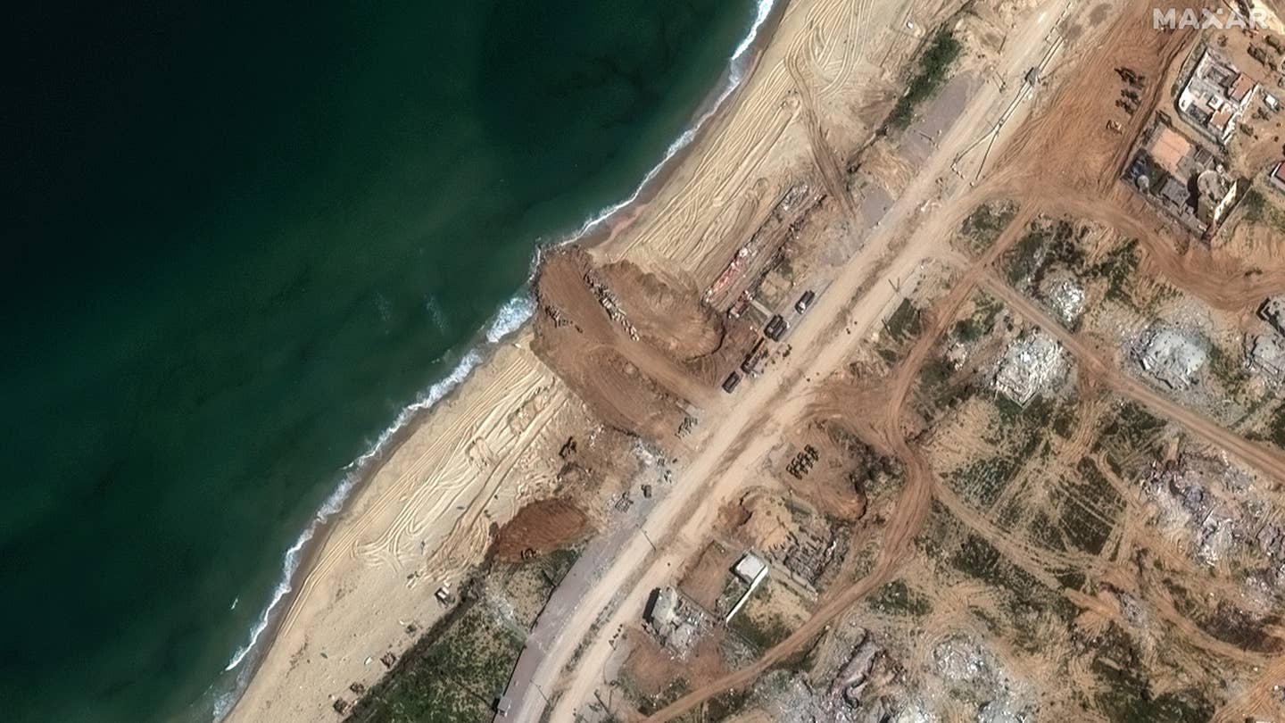 Continued work on reinforcing the beach area and the beginnings of the jetty itself can be seen in this image of the site taken on March 12. <em>Satellite image ©2024 Maxar Technologies</em>