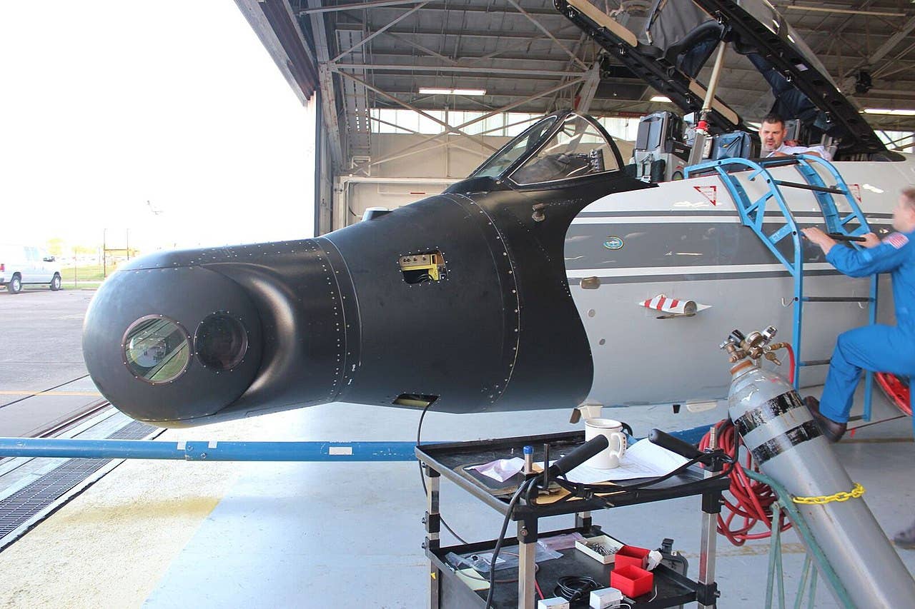 One of NASA's WB-57Fs with a turret with multiple types of cameras installed on its nose. <em>NASA</em>