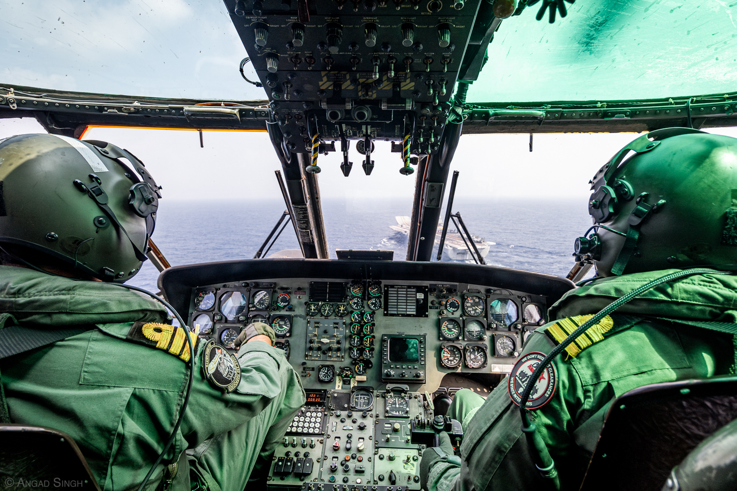 The Indian aircraft carrier INS <em>Vikramaditya</em> seen through the cockpit of a Sea King 42C as it approaches to land. <em>Angad Singh</em>
