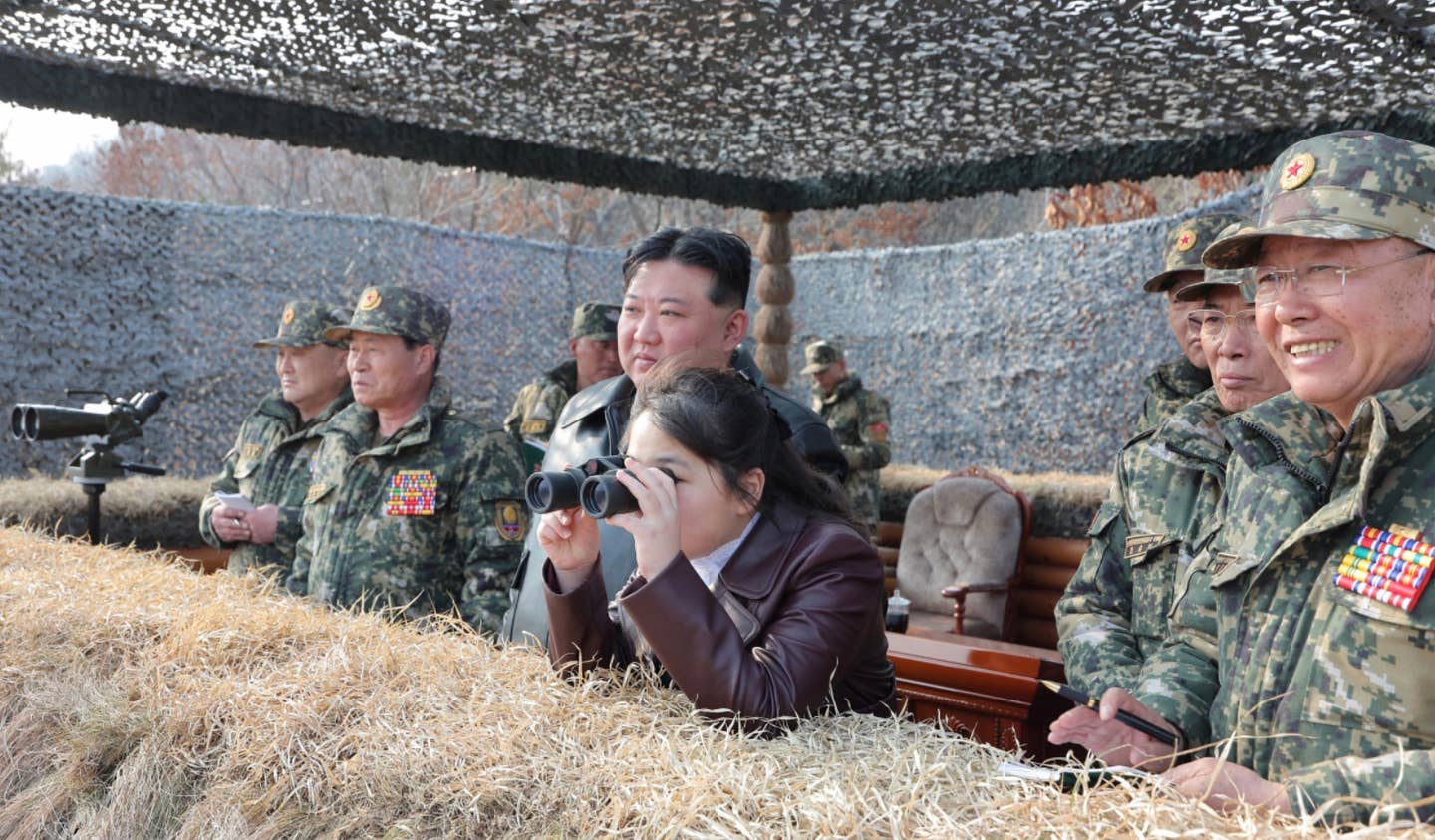 Kim and Ju Ae pictured on March 15 watching paratrooper drills. <em>Yonhap</em>