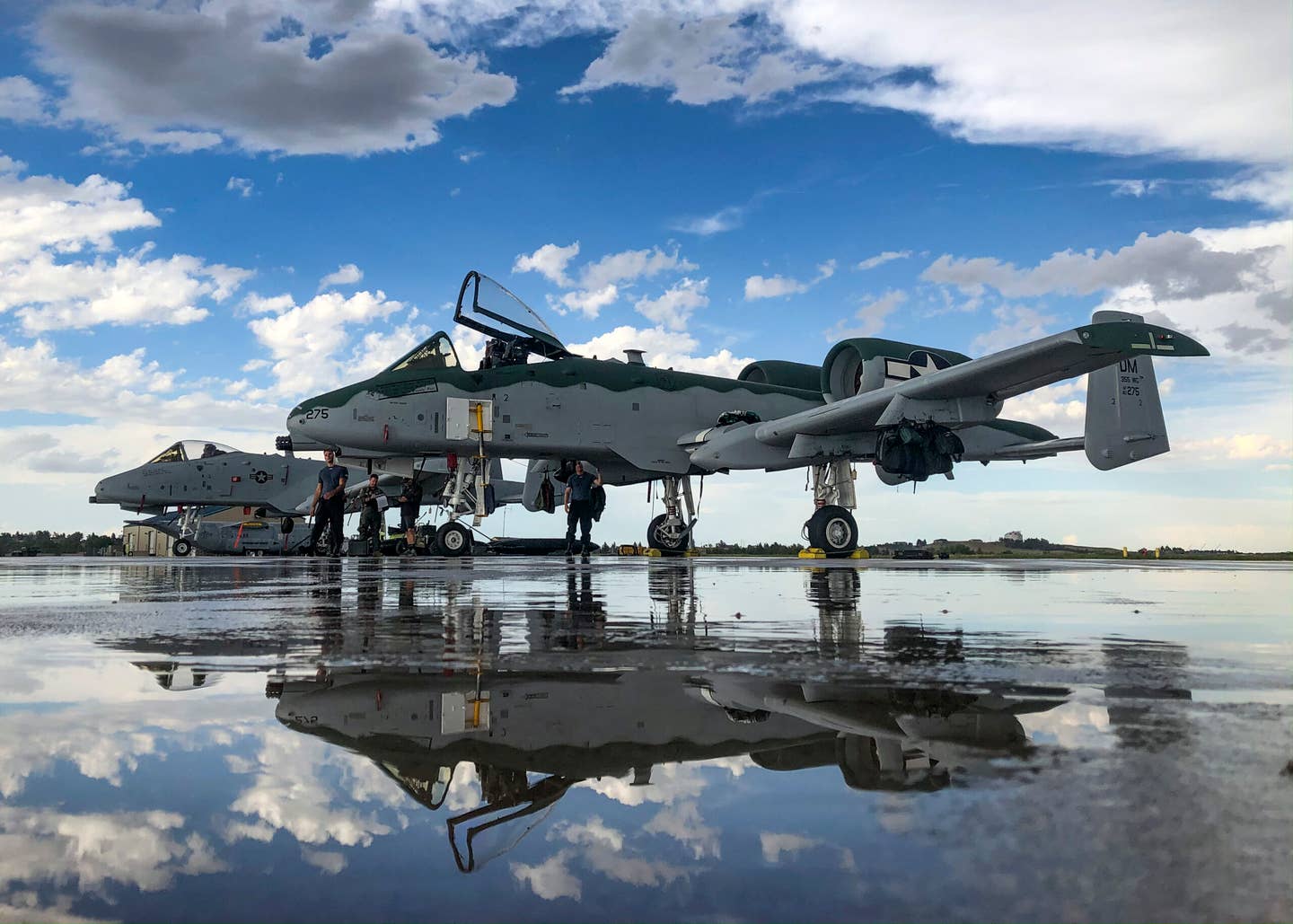 A-10Cs, assigned to the A-10 Demonstration Team, sit on the flight line at Wyoming Air National Guard, Wyoming, July 20, 2020. <em>U.S. Air Force photo by Senior Airman Kristine Legate</em>