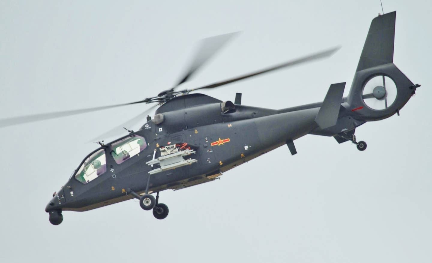 A Z-19 scout/attack helicopter making a low-level pass at the Zhuhai Airshow in November 2012. <em>Alert5/Wikimedia Commons</em>