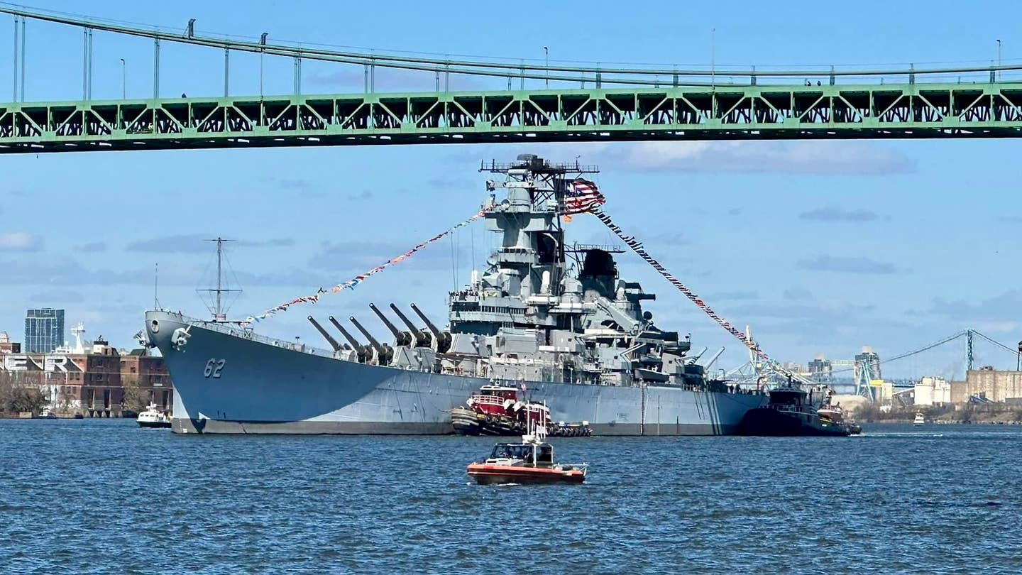 WWII-era battleship USS New Jersey pictured on the Delaware River for scheduled maintenance