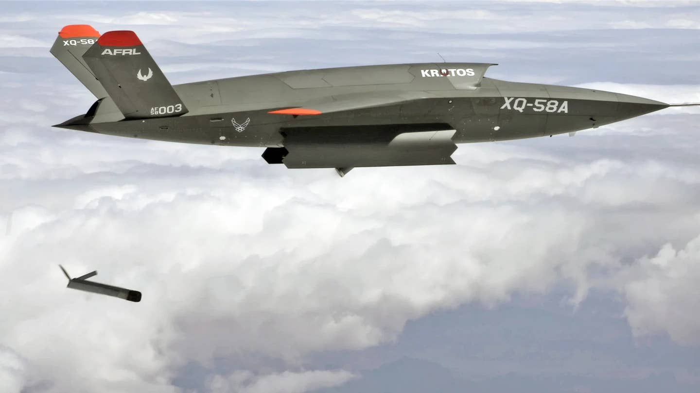 A US Air Force XQ-58A releases a smaller ALTIUS-600 drone from its internal payload bay during a test. <em>USAF</em>