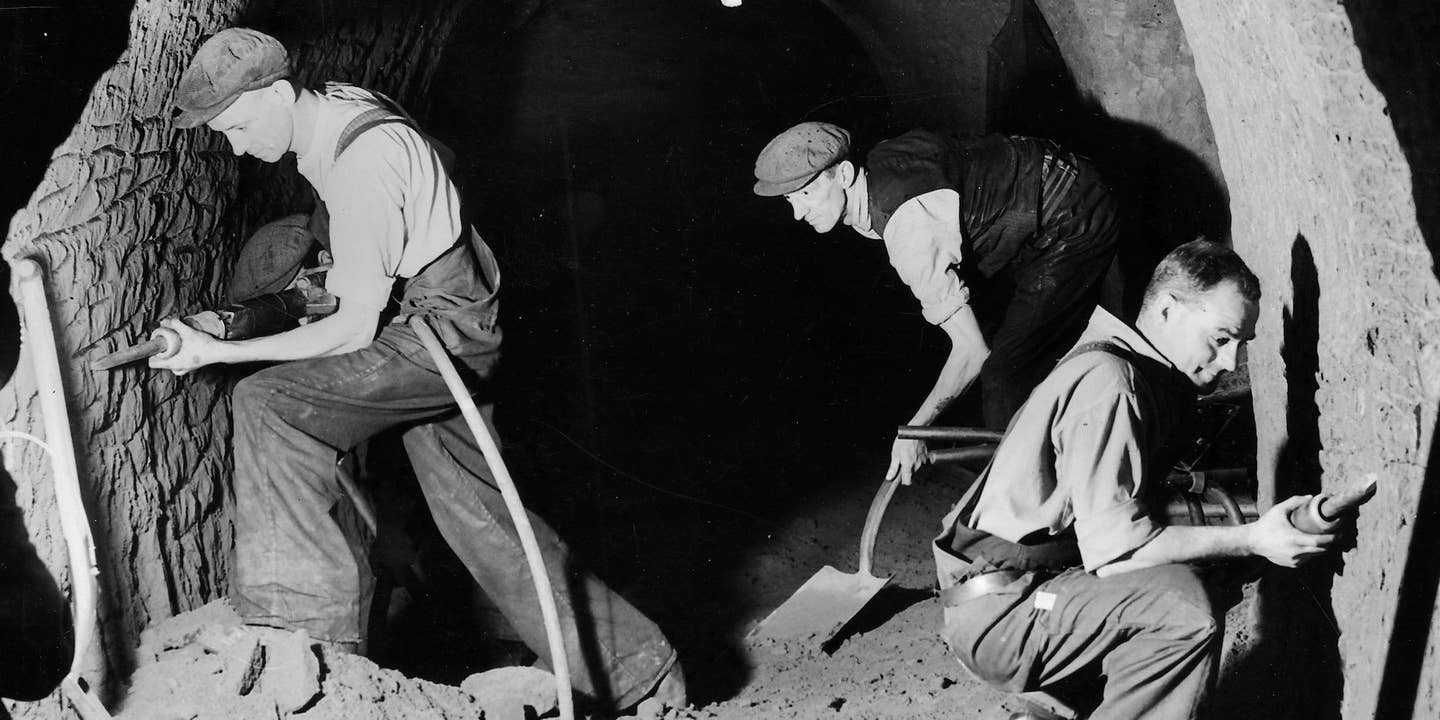 15th June 1939: Workmen digging deep air raid shelters in Stockport. (Photo by Fox Photos/Getty Images)