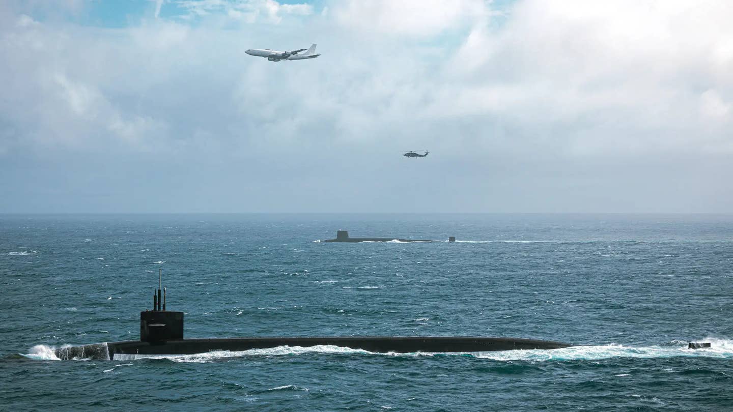 A US Navy <em>Ohio</em> class SSBN, in the foreground, sails alongside a Royal Navy Vanguard class boat, in the background. <em>USN</em>