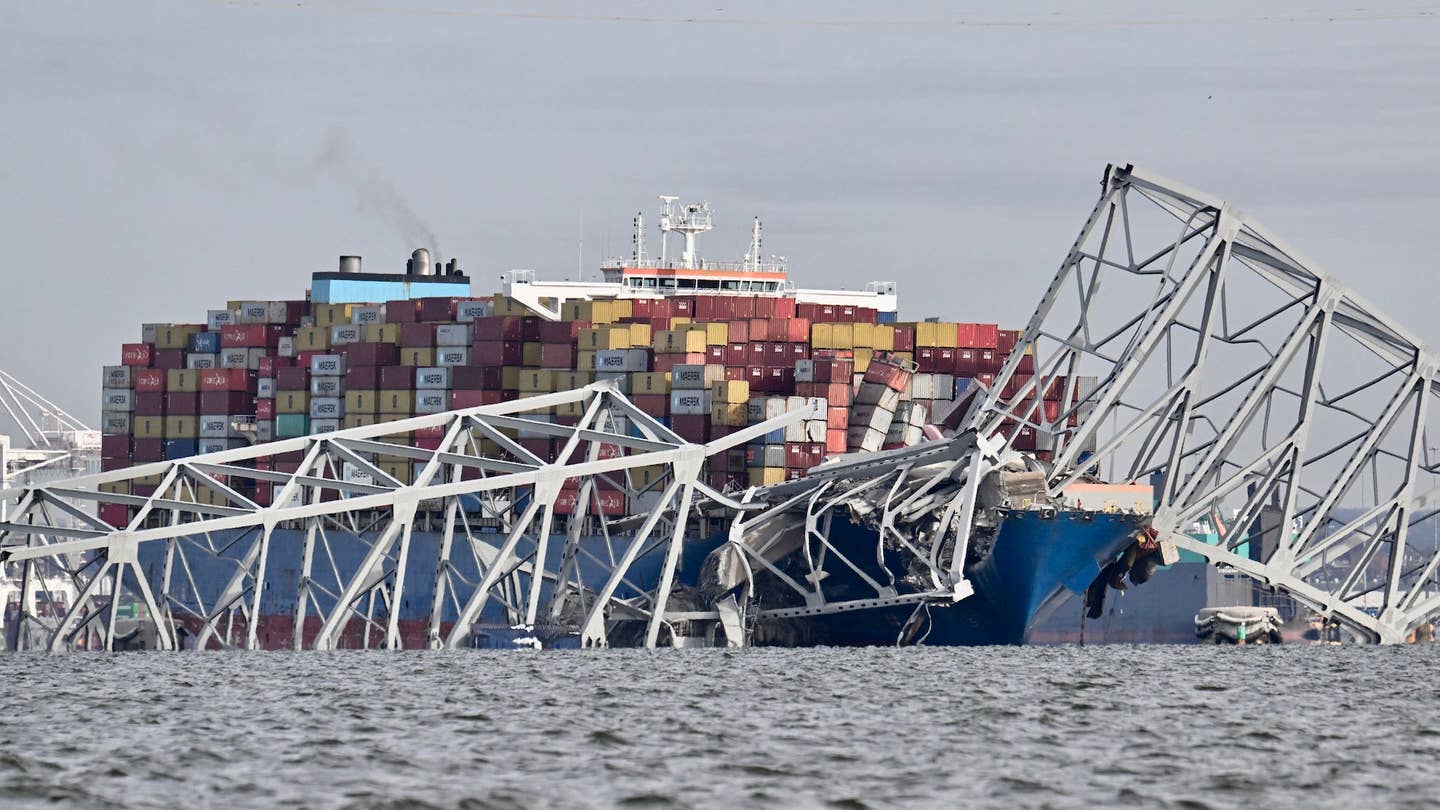 The steel frame of the Francis Scott Key Bridge sits on top of the container ship Dali after the bridge collapsed, Baltimore, Maryland, on March 26, 2024