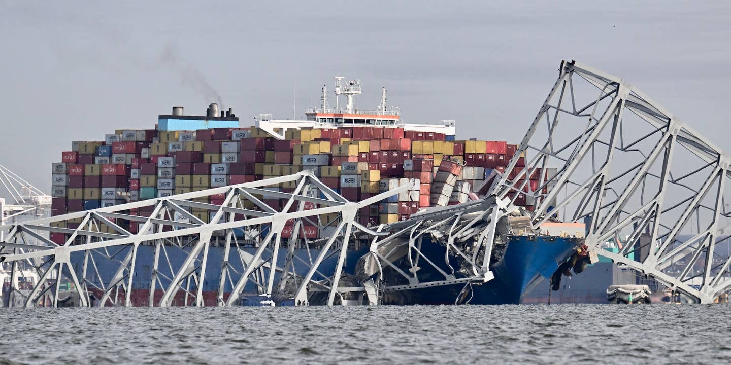 The steel frame of the Francis Scott Key Bridge sits on top of the container ship Dali after the bridge collapsed, Baltimore, Maryland, on March 26, 2024