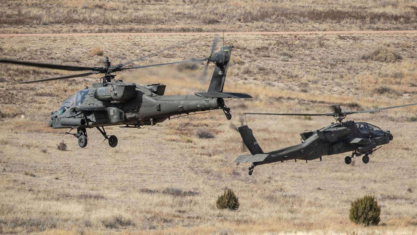 A pair of AH-64 Apaches assigned to the 4th Combat Aviation Brigade. <em>US Army</em>