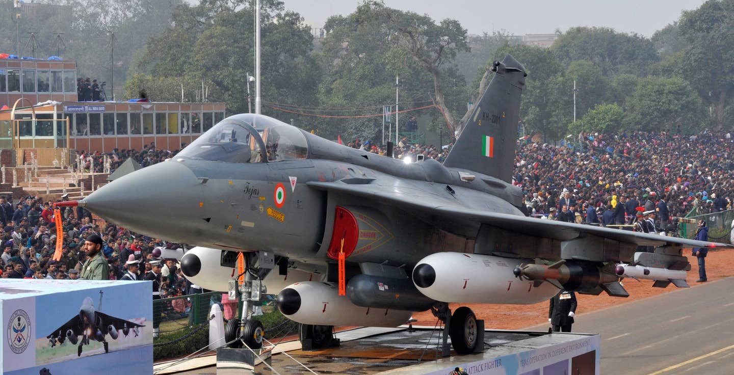 Fitted with a full load of external stores, an Indian Air Force Tejas Mk 1 during a full dress rehearsal for Republic Day Parade at Rajpath on January 23, 2014, in New Delhi, India. <em>Photo by Mohd Zakir/Hindustan Times via Getty Images</em>