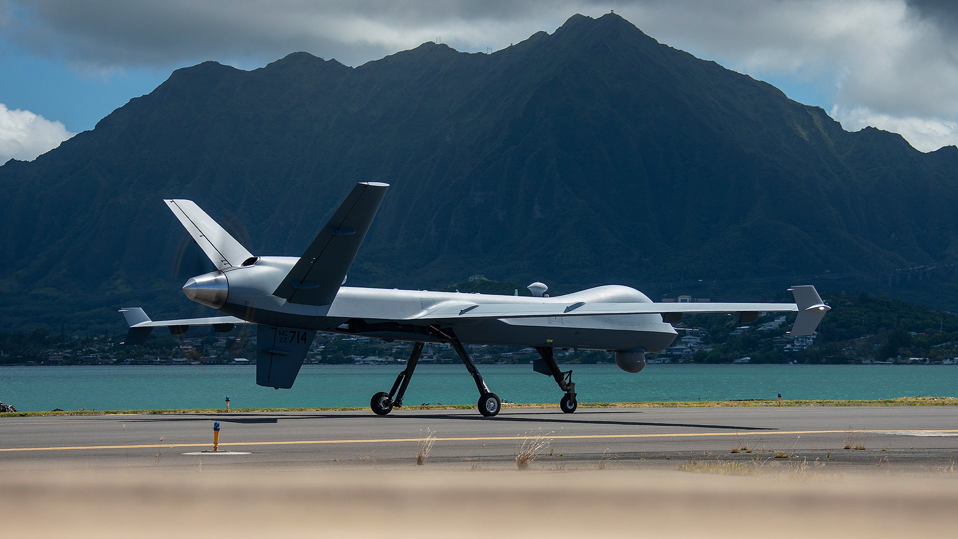 U.S. Marine Corps Marine Unmanned Aerial Vehicle Squadron (VMU) 3, Marine Aircraft Group 24, maneuvers an MQ-9A down the flight line on Marine Corps Air Station Kaneohe Bay, June 20, 2023. The MQ-9A is a remotely piloted aircraft capable of supporting a wide range of operations such as coastal and border surveillance, weapons tracking, embargo enforcement, humanitarian and disaster assistance, support of peacekeeping and counter-narcotic operations. VMU-3 supports the Marine Air-Ground Task Force by providing multi-surveillance and reconnaissance, data gateway and relay capabilities through an aerial layer, and enabling or conducting the detection and cross cueing or targets and facilitating their engagement during expeditionary, joint and combined operations. (U.S. Marine Corps photo by Cpl. Cody Purcell)