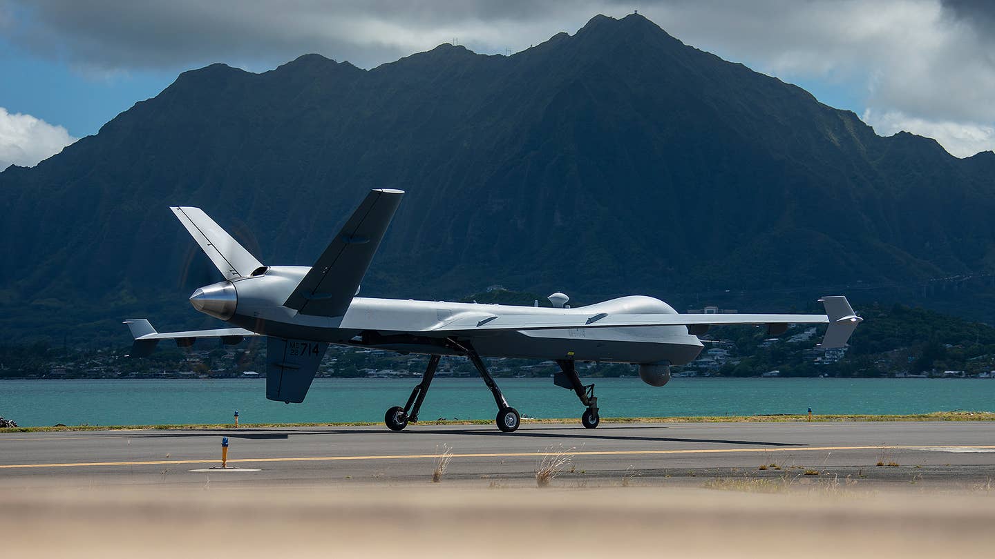 U.S. Marine Corps Marine Unmanned Aerial Vehicle Squadron (VMU) 3, Marine Aircraft Group 24, maneuvers an MQ-9A down the flight line on Marine Corps Air Station Kaneohe Bay, June 20, 2023. (U.S. Marine Corps photo by Cpl. Cody Purcell)