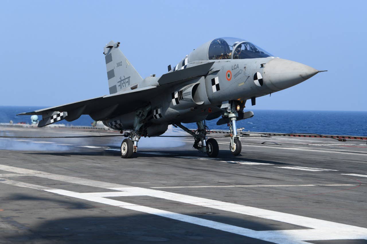 The LCA Navy prototype NP-2 landing on the aircraft carrier INS <em>Vikramaditya</em> in January 2020. DRDO