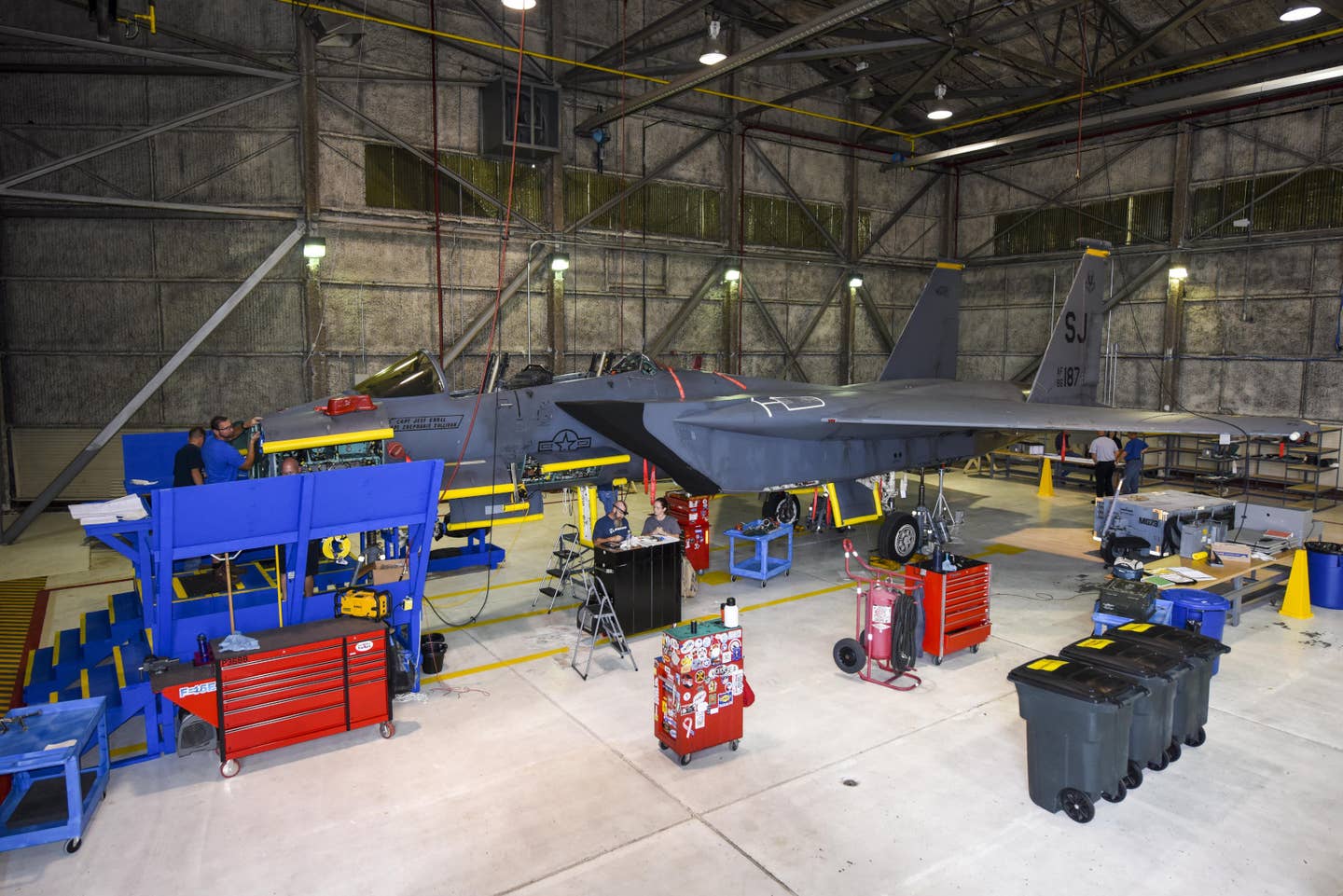 An F-15E Strike Eagle, another aircraft type the Air Force is seeking extra funding for spare parts for, is seen here undergoing work to upgrade its radar. <em>USAF</em>