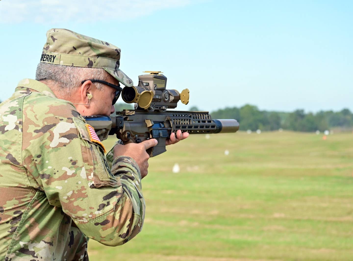 U.S. Army Fort Campbell Garrison Commander Col. Christopher Midberry fires a Next-Generation Squad Weapon (NGSW) Machine Gun during a weapon familiarization demonstration, September 25, 2023. <em>U.S. Army photo by Kayla Cosby</em>