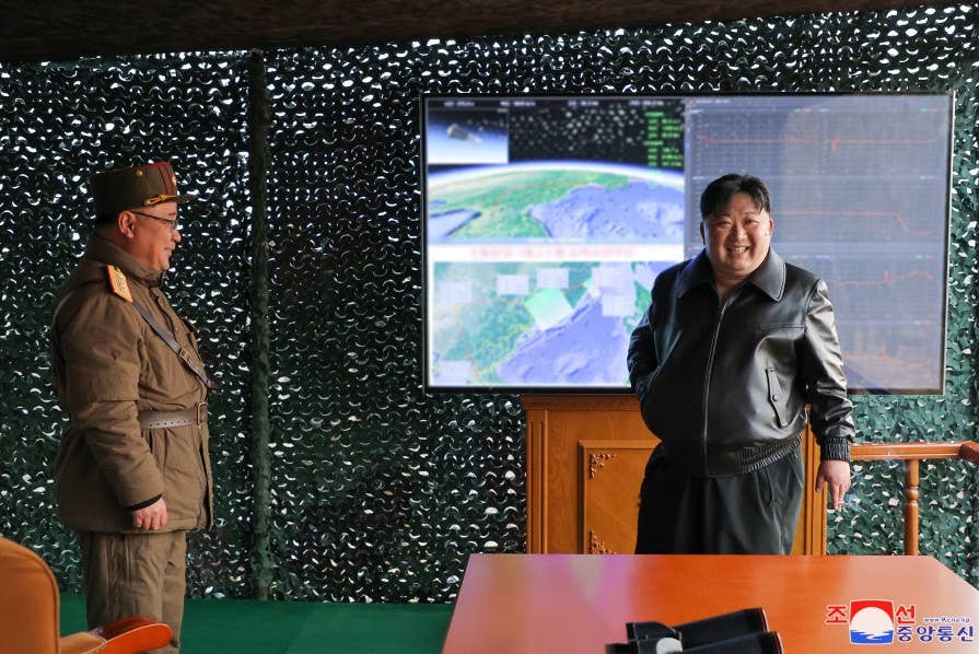 A picture of Kim Jong Un at the recent Hwasongpho-16B test. The maps seen behind show details that align with the North Korean claims about the missile's flight. <em>KCNA</em>