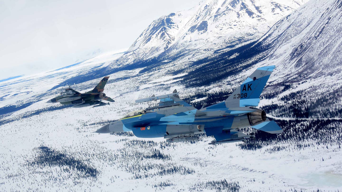 Two U.S. Air Force F-16 Fighting Falcons assigned to the 18th Aggressor Squadron fly over the Joint Pacific Alaska Range Complex (JPARC), on April 17, 2020. The JPARC is the Department of Defense's largest training range spanning more than 70,000 square miles. (U.S. Air Force photo by Tech. Sgt. Jerilyn Quintanilla)