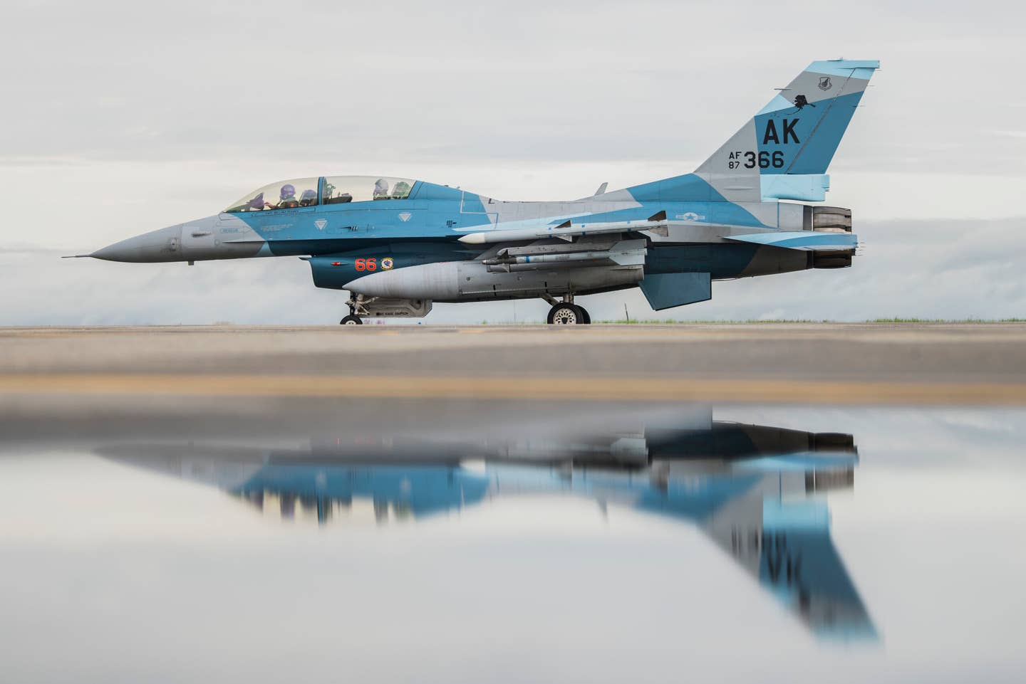 A U.S. Air Force F-16 Fighting Falcon, assigned to the 18th Aggressor Squadron&nbsp;(AGRS) taxis during RED FLAG-Alaska (RF-A) 21-3 at Eielson Air Force Base, Alaska, Aug. 26, 2021. RF-A, a Pacific Air Forces-sponsored exercise held three to four times a year, allows the 18th AGRS to prepare pilots and aircrews from visiting units for conflicts against near-peer adversaries. (U.S. Air Force photo by Senior Airman Aaron Larue Guerrisky)