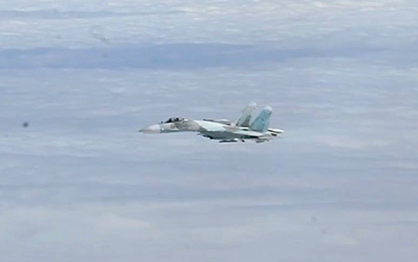 A still picture of a Russian Su-27 flying alongside a B-52 as it approached Bornholm Island on August 28, 2020.&nbsp;<em>NATO</em>