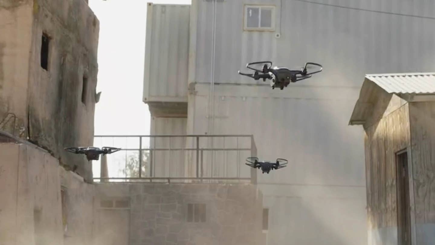 Nova quadcopters prepare to enter a building. <em>Shield AI</em>